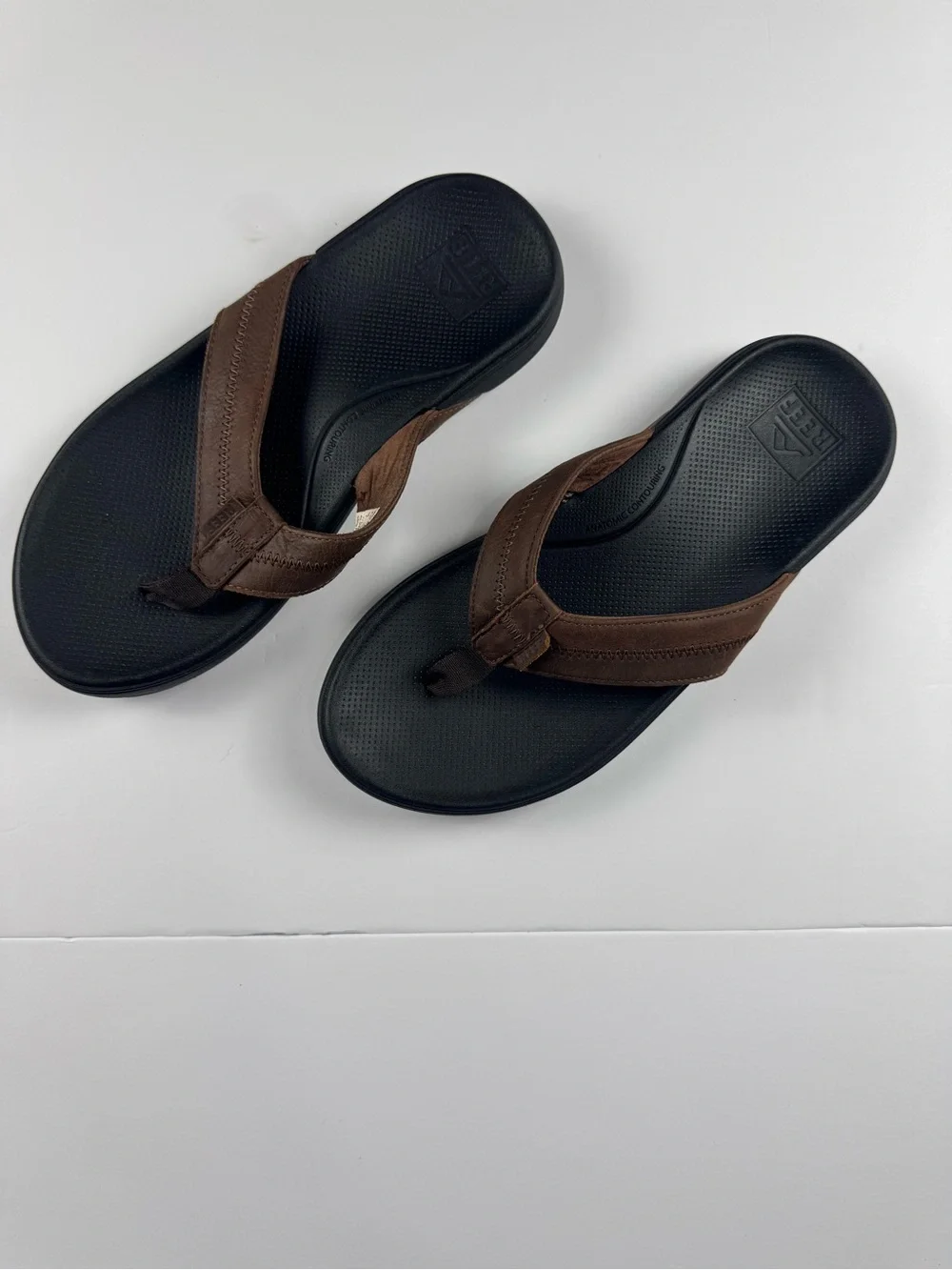 Reef Men's Brown and Black Leather-Style Flip Flops